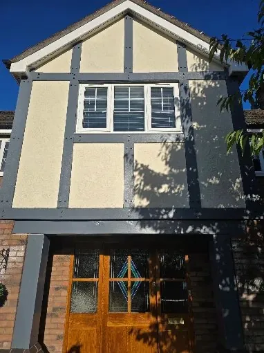 Mock Tudor front with cream render and grey timbers